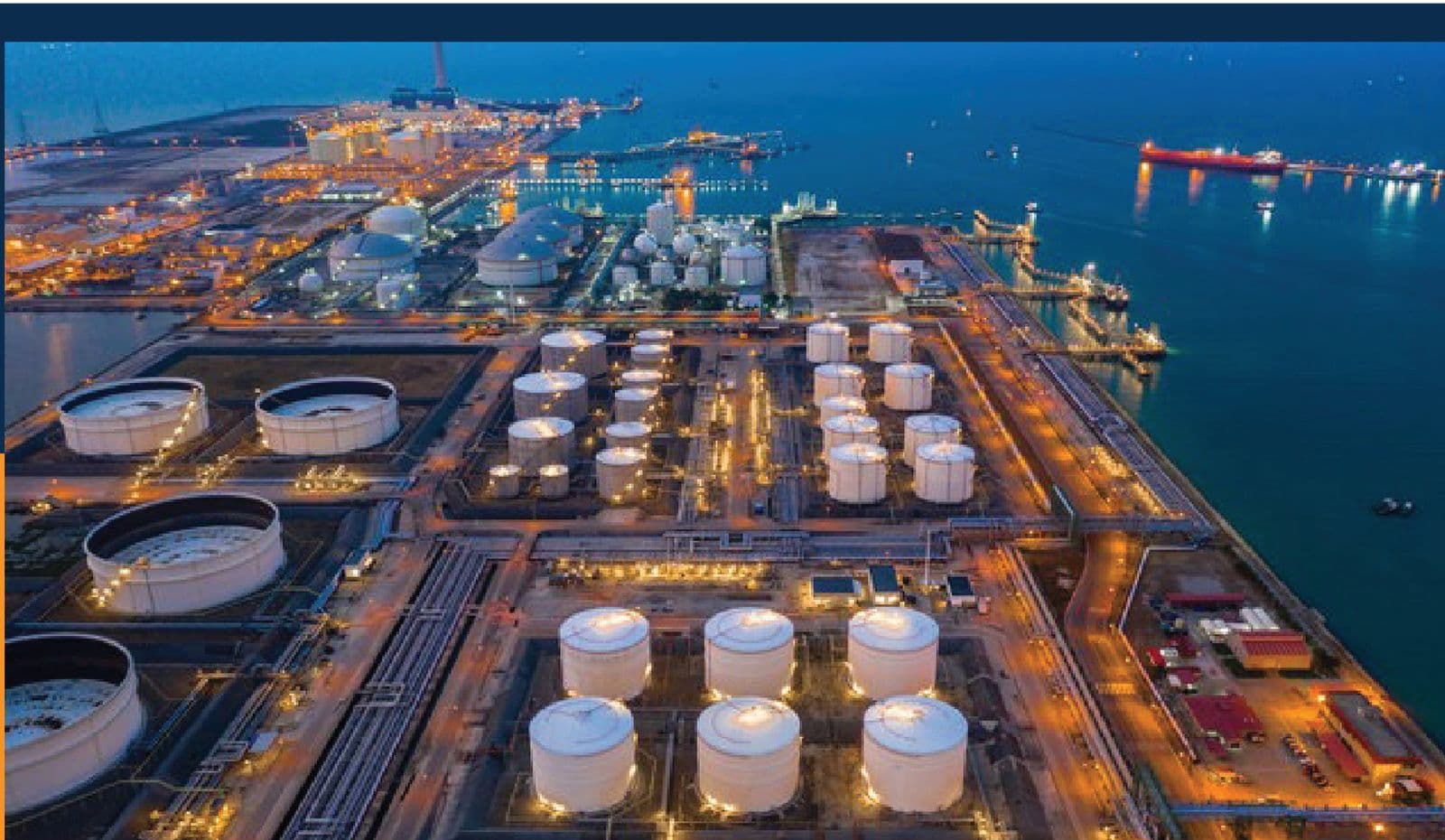 Oil and gas storage terminal illuminated at night
